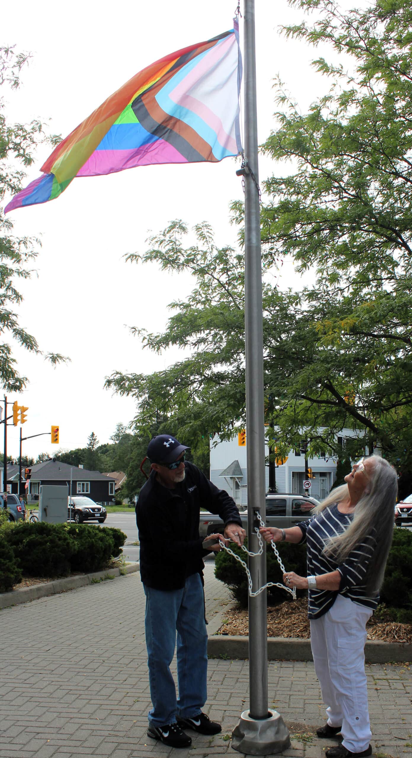 Marion Steele raises the Pride Flag. Pride Week Flag Raising Ceremony on August 21, 2023