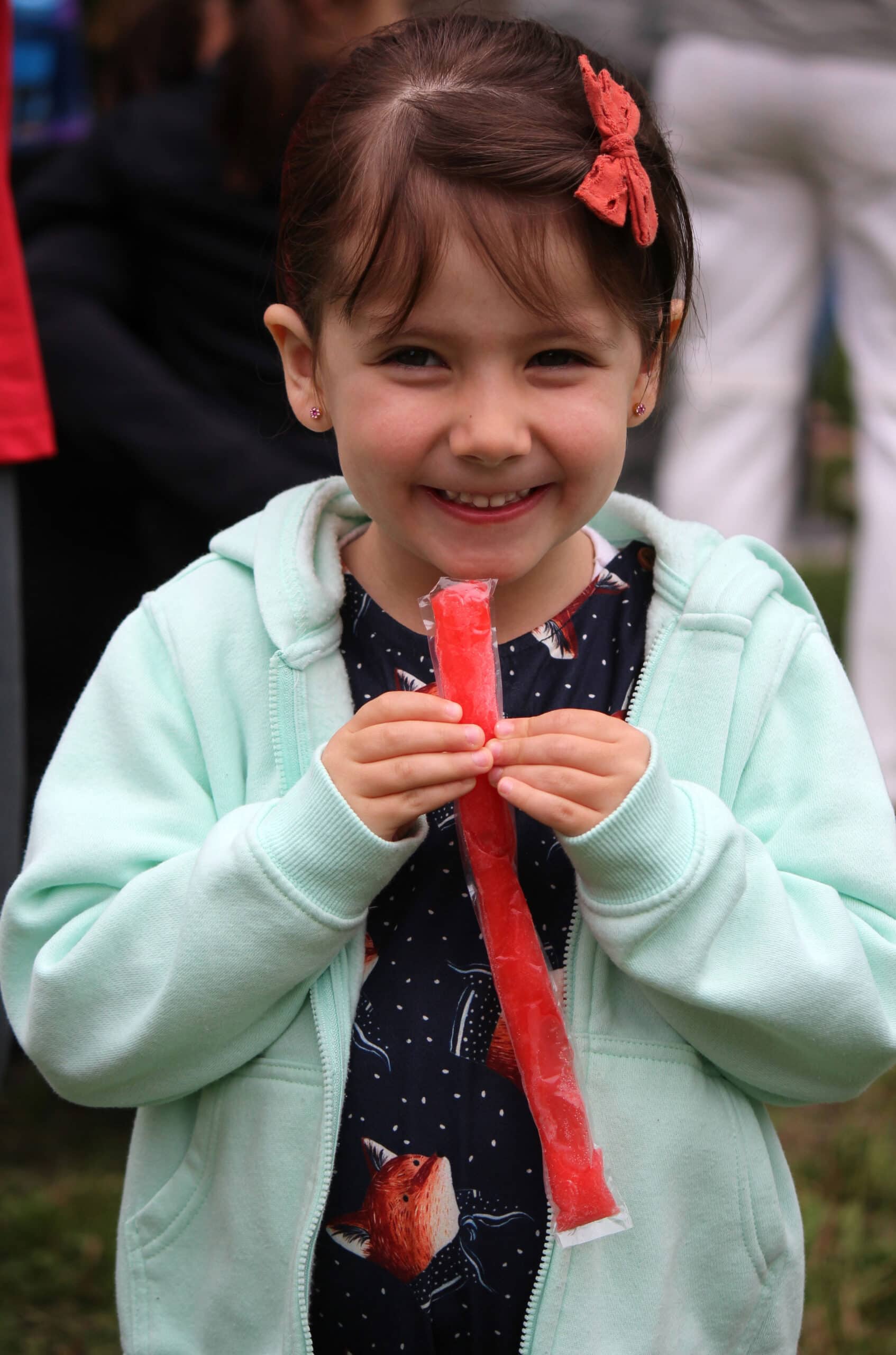 A girl with a freezie at Village Square Park