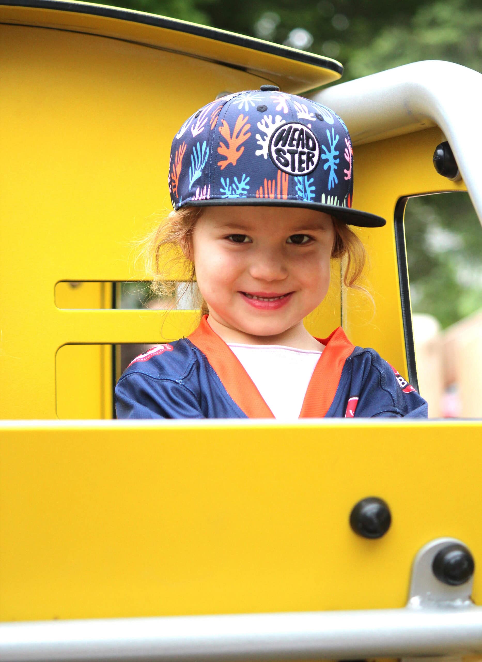A kid plays on the train at Village Square Park