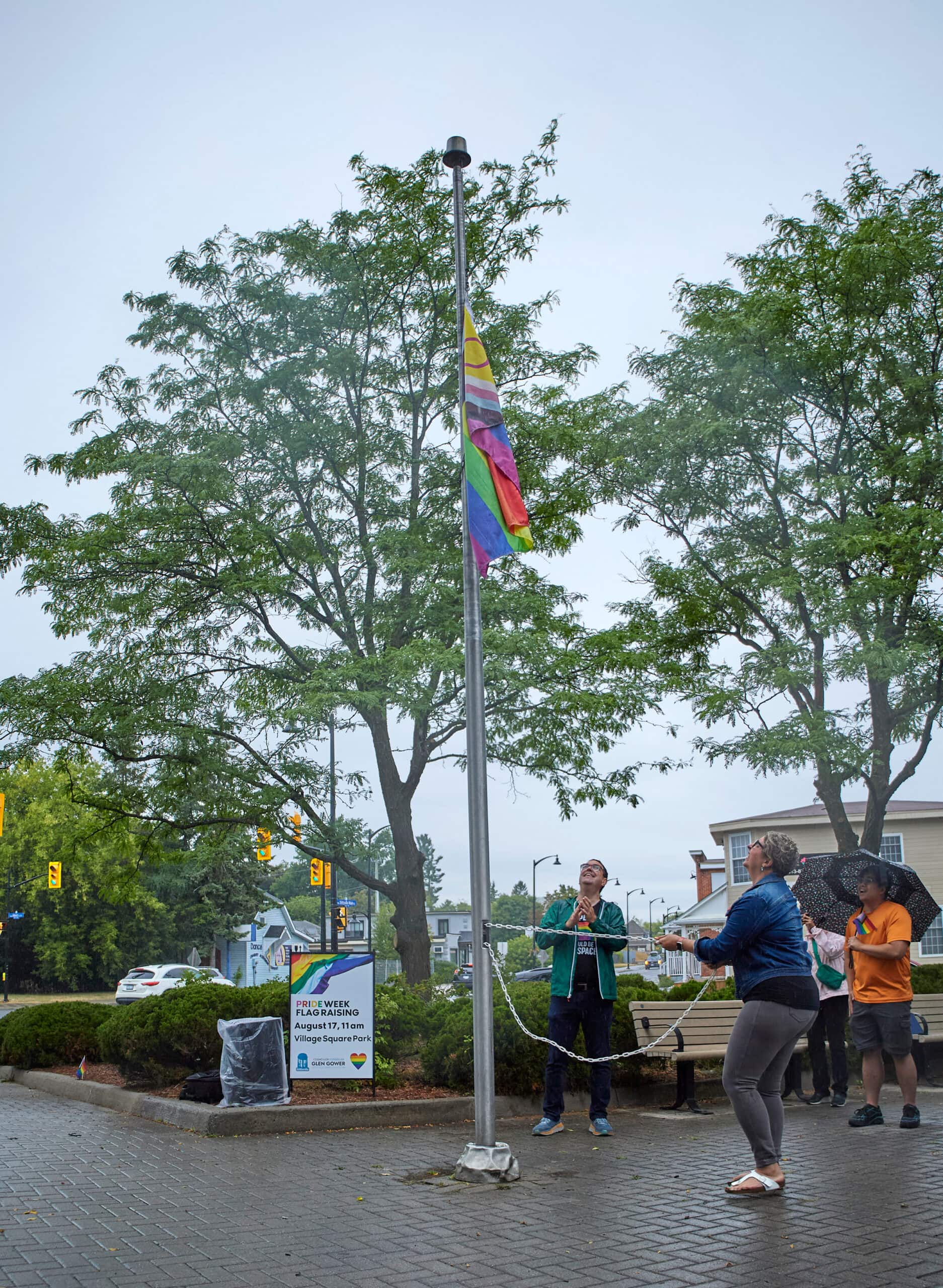 Ariel Troster raises the flag at the 2025 Pride Week Flag Raising Ceremony in Stittsville